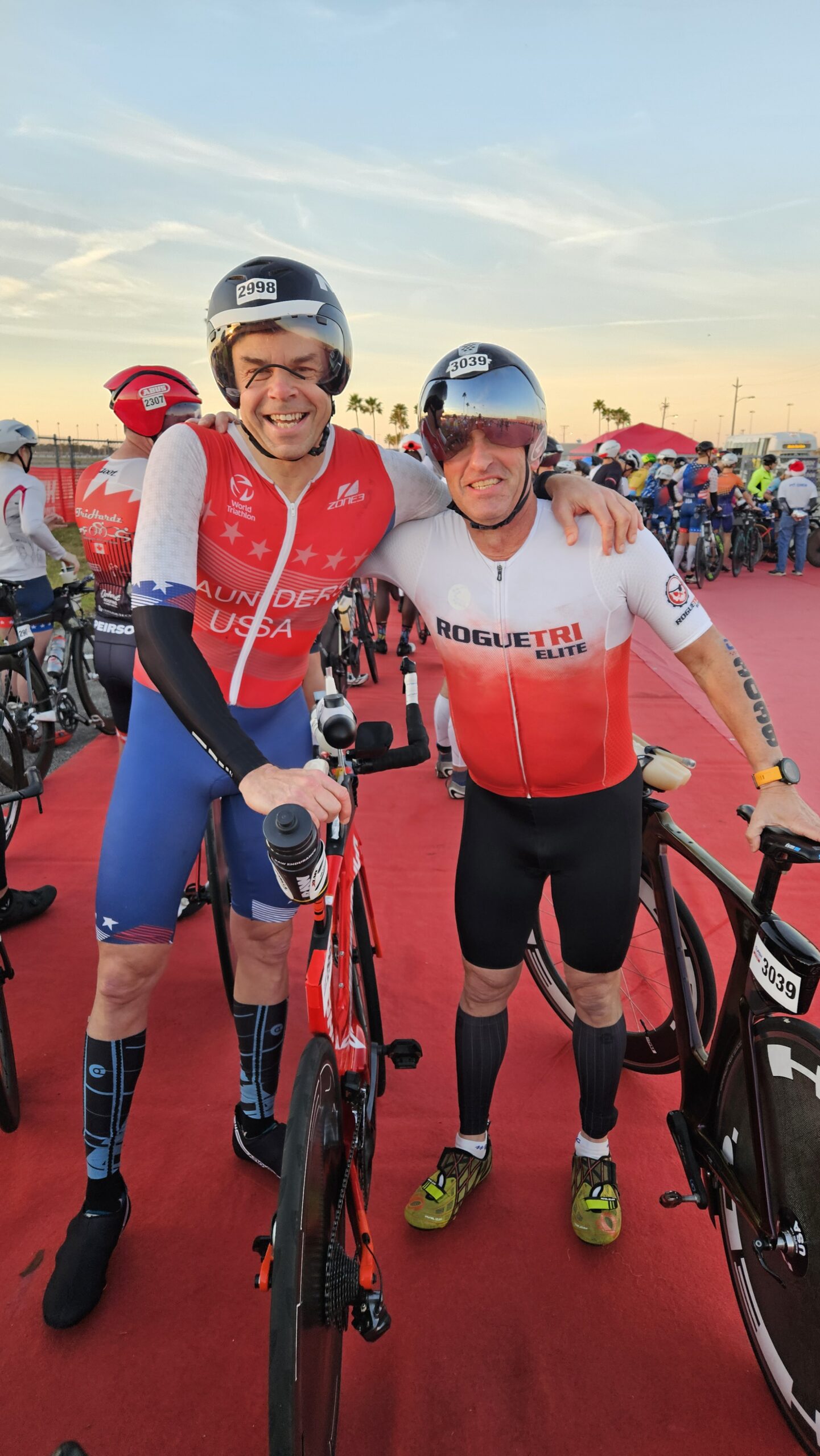 Two cyclists at a race.