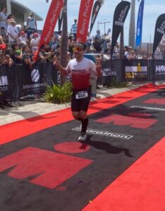 RogueTri athlete finishing an Ironman race