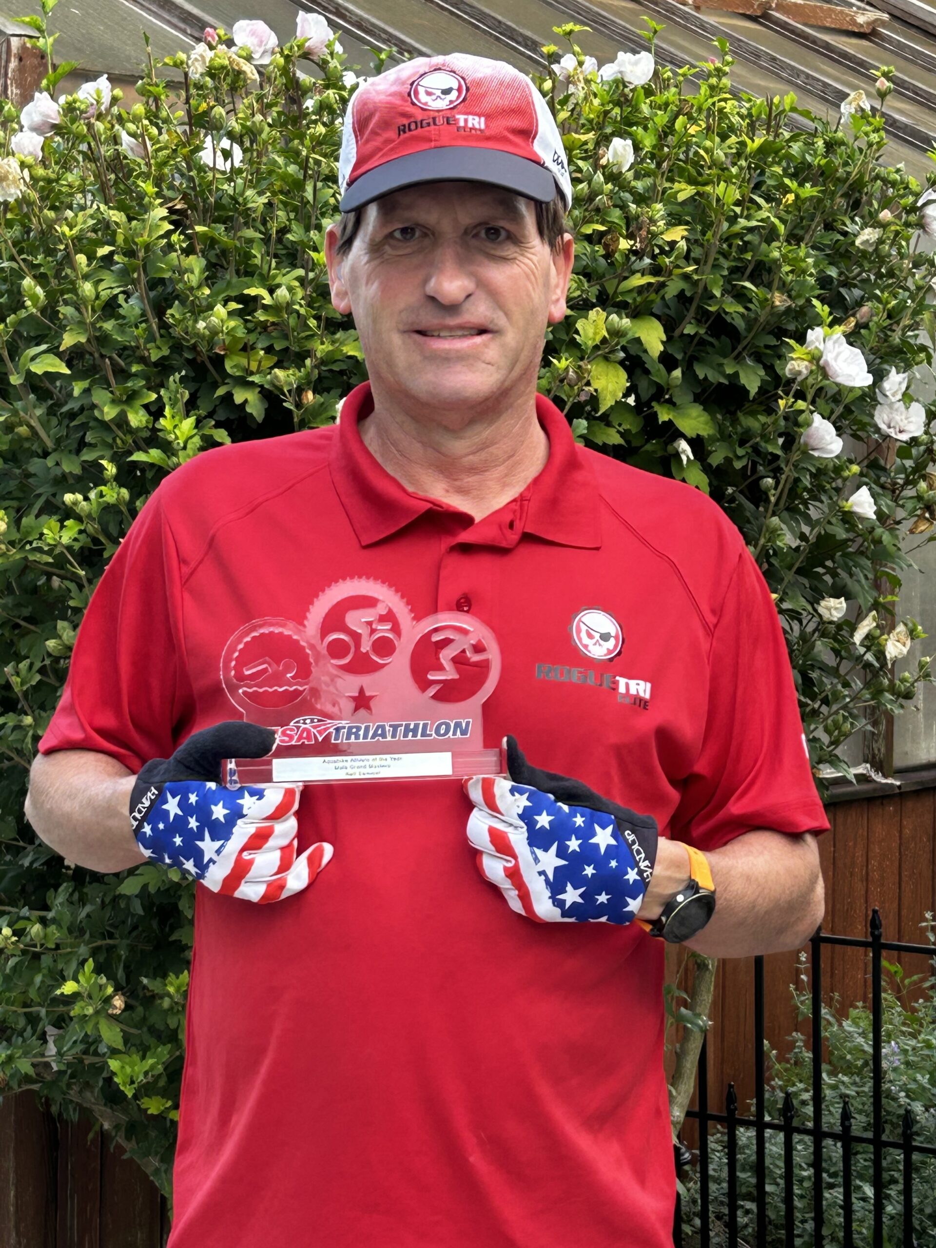 Neil Semmel RogueTri EliteTeam, posing with trophy