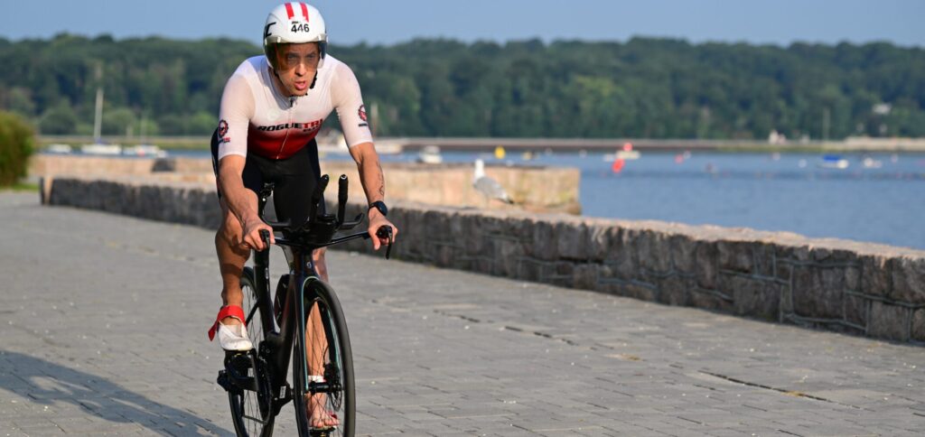 Scott Green cycling by the water.