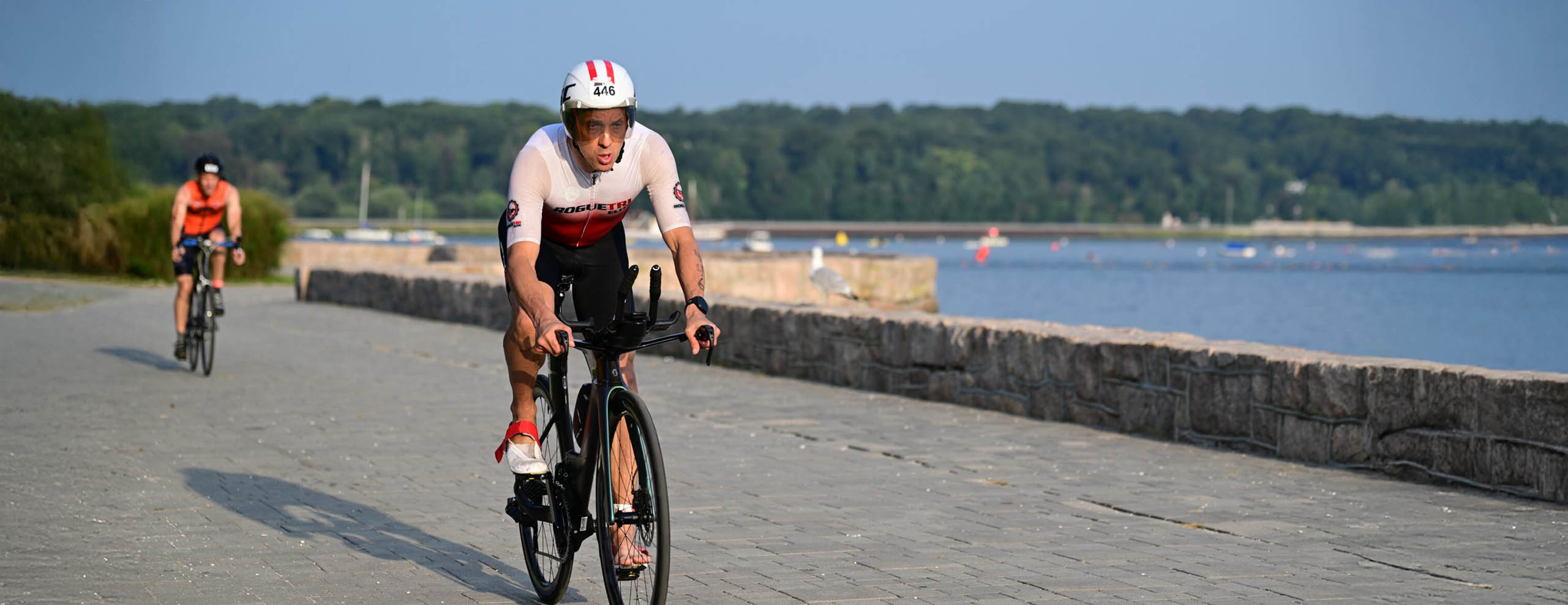 Scott Green cycling by the water.